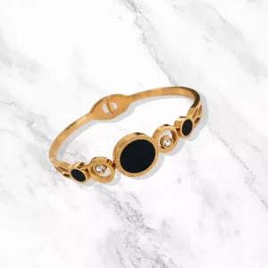 Bracelet Cyra en acier inoxydable doré avec pierres scintillantes