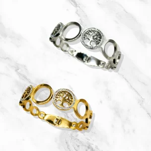 Bracelet "Éclat de Vie" dans les versions dorée et argentée, ronds ajourés et arbres de vie scintillants.